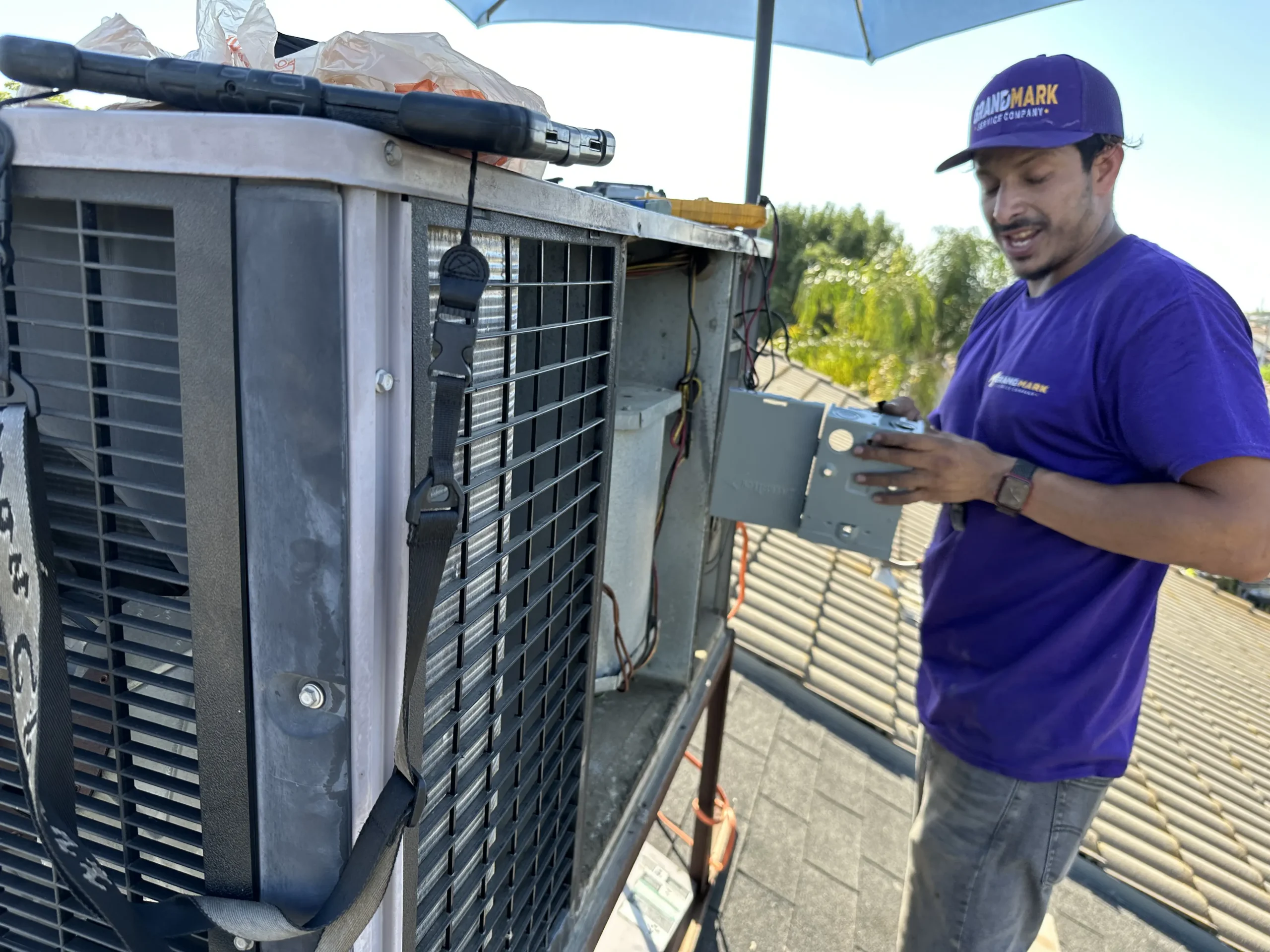 Grandmark HVAC technician repairing AC unit Fresno